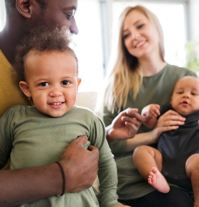 parents holding their children