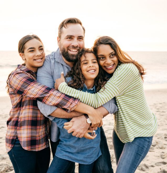 teens with parents on the beach